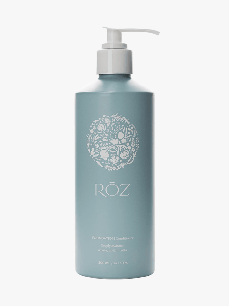 Roz Foundation Conditioner in branded component on a light gray background