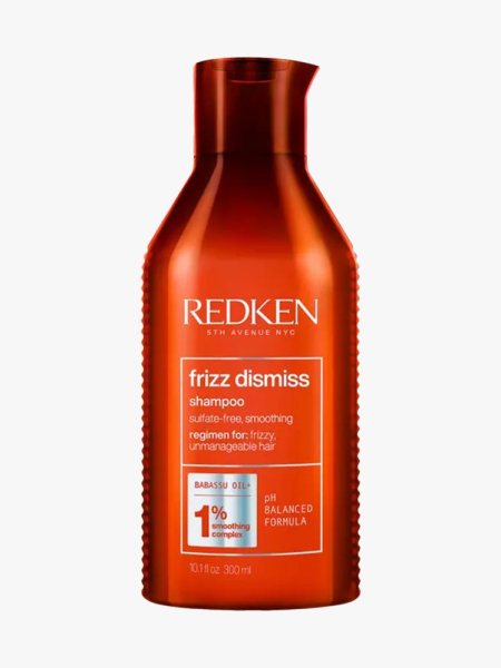 Redken Frizz Dismiss Sulfate-Free Shampoo copper bottle of shampoo on light gray background